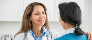 Female doctor talking to female patient