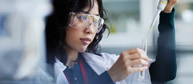 Female doctor performing test in laboratory