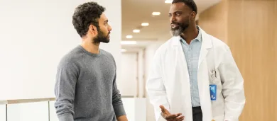 Male doctor talking to male patient