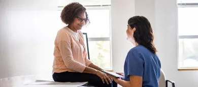 Female doctor performing tests on a female patient