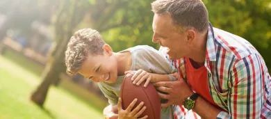 Father and son engaging in physical activity