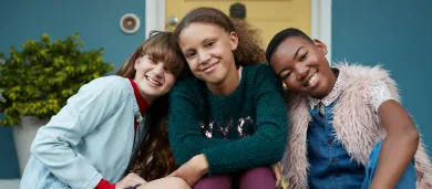 Three pediatric patients smiling